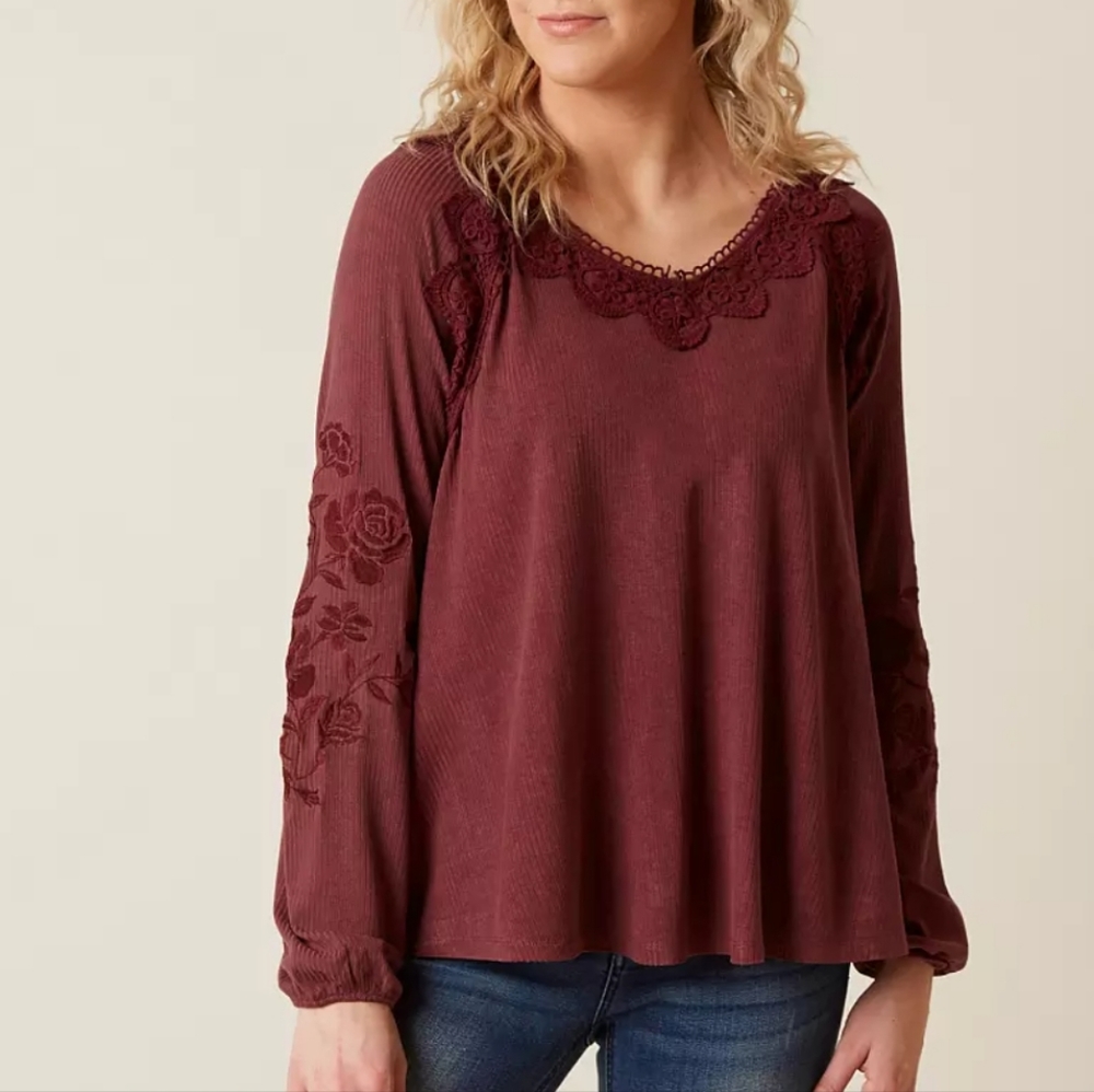 Long sleeve blouse with floral accents